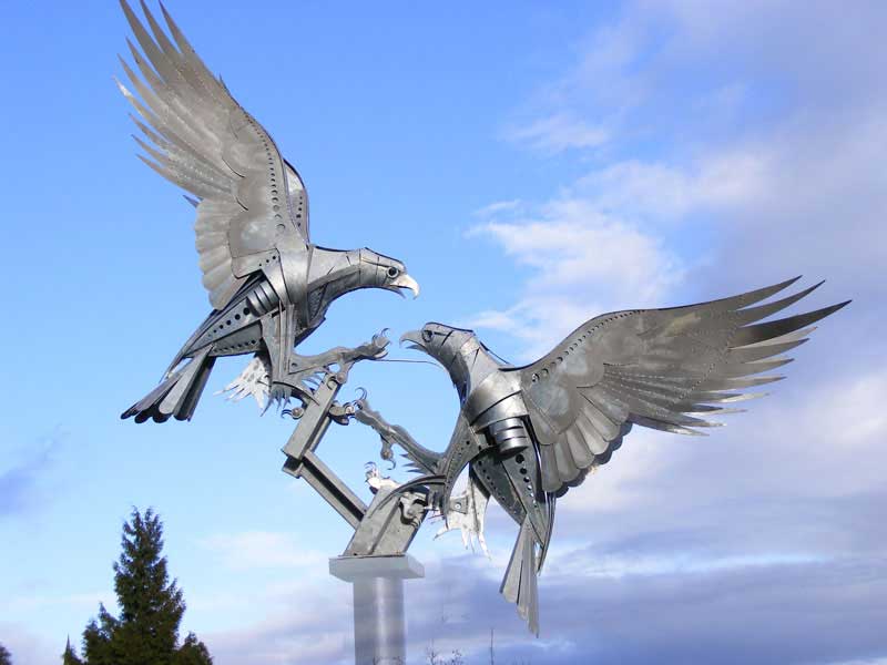 Sculpture of two buzzards in flight